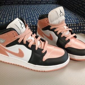 Air Jordan Mid Sneakers in Black, White, and Pink